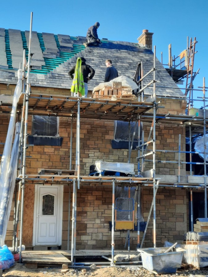 The tiles being laid on James' self-build home