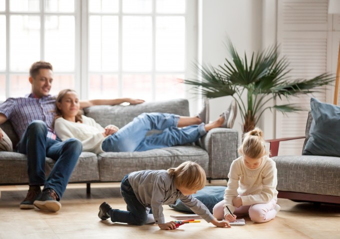 Family at home on the sofa